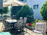 The best seat in the house might not be in the house at all. Surrounded by trees and flowers, this outdoor space feels like a little slice of lake-town heaven.