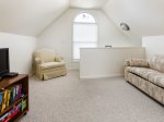 Kick Your Feet Back and Unwind in the Cozy Living Room After a Day Spent by the Shoreline