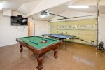 Clean 2 car garage w/ epoxy flooring has been converted to a game room