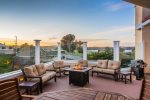 Relax on the deck with firepit and enjoy the sun setting over the bay