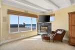 Enjoy the fireplace and tv with sounds of the waves in the background