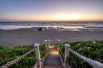 Down the stairs to the sand at sunset, nothing more magical
