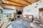 Living room complete with comfortable seating and flat screen tv