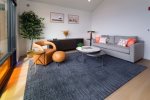 Cozy living room with pops of color and queen sized sleeper sofa
