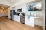 Kitchen includes full-size fridge, microwave, electric double burner, toaster oven, Keurig, and dishwasher
