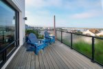 Step outside onto your private deck to enjoy views of the rock and harbor beyond