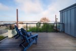 Sip your morning coffee while the harbor comes alive right before your eyes