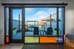Step outside onto your patio overlooking the shared community BBQ area to enjoy views of the rock and harbor beyond