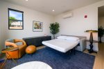 Living room features a queen sized sleeper sofa for additional sleeping space