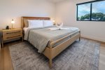 Retreat to the bedroom featuring a king sized bed