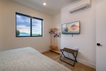 Bedroom also features a flat screen tv