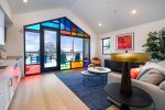 Enjoy Morning light pouring through avant-garde windows in living room and kitchen spaces