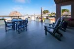 Step outside onto your private deck to enjoy views of the rock and harbor beyond