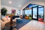 Enjoy Morning light pouring through avant-garde windows in living room and kitchen spaces