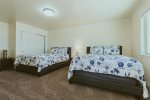 Second downstairs bedroom with 2 double beds