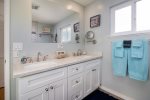 The large master bathroom was recently remodeled and offers dual vanities and a step in shower