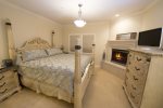 The master bedroom is exquisitely furnished and has a king sized bed