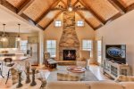 Farmhouse living area - gas stack stone fireplace