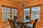 Seating for 4. Enjoy a meal all while never leaving that view