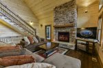Comfortable seating around the fireplace or TV