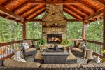Enjoy An Evening By The Wood Burning Outdoor Fireplace 