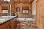 Master bathroom with double vanity and soaking tub