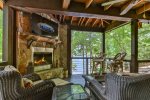 Whisperbend Offers An Outdoor Fireplace With TV Overlooking The River