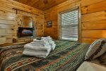 Main Level Queen Bedroom With TV