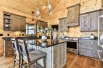 Fully Stocked Kitchen With Space For Cooking 