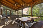 Outdoor Dining Area  Seating On Screened In Porch 