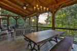 Screened In Porch With Seating And Table. Perfect For Gathering 