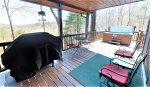 Deck with grill, seating, hot tub and views