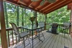 Large covered deck with outdoor dining