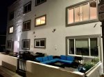 Night time lit patio with lots of security lights & cameras