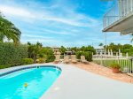 Your backyard with a beautiful pool and outdoor seating.