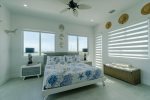 3rd level king bedroom master suite with shared balcony overlooking the pool and open water.
