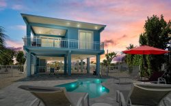 Ocean Oasis ~ Pool home with 35' of dockage, walk to Coco Plum Beach!