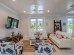 Cozy living room retreat with a sofa and a smart TV.