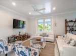 Cozy living room retreat with a sofa and a smart TV.