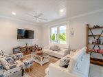 Cozy living room retreat with a sofa and a smart TV.