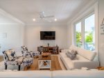 Cozy living room retreat with a sofa and a smart TV.