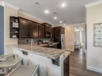 Cook in style with this sleek, modern kitchen featuring top-of-the-line stainless steel appliances.