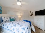 Main level bedroom with Workstation and TV with Ensuite Bathroom.