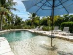 Pool with sunshelf.