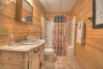Lower level bathroom with a tub shower combo 