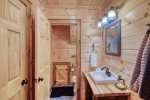 Lower level bathroom offers a tub shower combo 