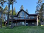 Back of house has a nice, large porch & lawn 