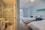 Guest bedroom on 3rd floor with ensuite bath, 2 single beds, one with trundle to sleep 3