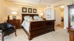 Waterfront master bedroom with king bed