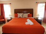 Upstairs king room with balcony, attached ensuite and a TV